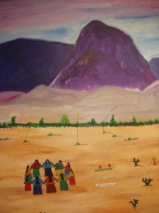Tohono O’odham women gather in a circle in the desert to pray.